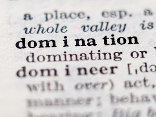 Dictionary definition of word domination. Selective focus.