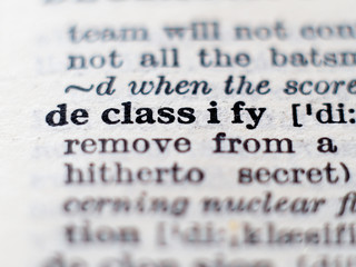 Obraz premium Dictionary definition of word declassify. Selective focus.