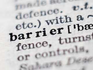 Dictionary definition of word barrier. Selective focus.