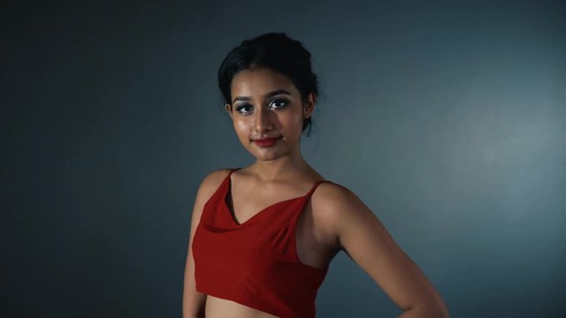 Beautiful young Indian girl posing in studio, showing ethnical diversity.