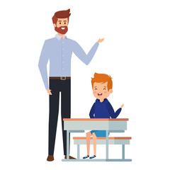 student boy seated in school desk with male teacher