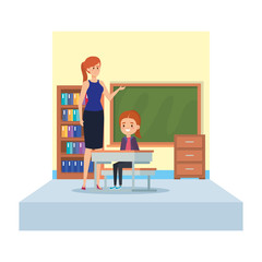 female teacher and girl seated in desk in classroom