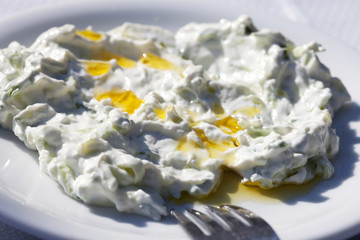 National Greek food - tzatziki served on a white plate