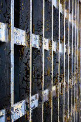 Rusted bars inside a jail cell
