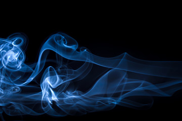 Blue smoke abstract on black background, darkness concept