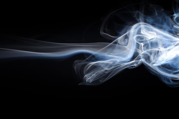 Obraz premium Blue smoke abstract on black background, darkness concept