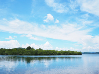 Green coast and blue sky on tropical island