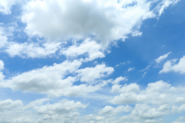 Naklejka na ściany i meble White clouds in blue clearly sky in summer