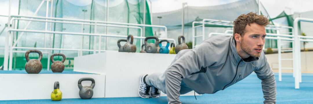 Pushup Fitness Man Exercising In Outdoor Gym Doing Workout Push Up Banner Panorama. Young Healthy Male Athlete.