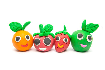 Play dough Fruit imitation on white background. Handmade clay plasticine