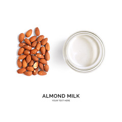 Creative layout made of almond milk and almonds on white background. Flat lay. Food concept. 