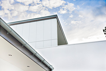 Modern building with walls and roof shoe the drain pipe