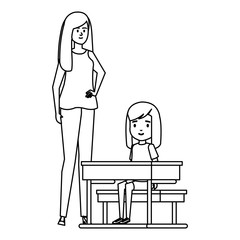 student girl in school desk with female teacher