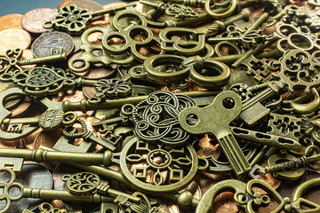 Old vintage keys gold texture on copper coin  abstract background.