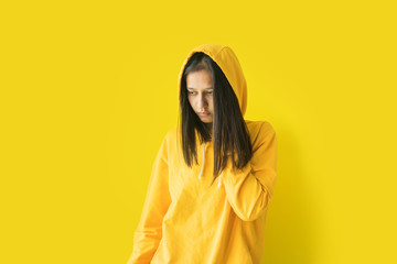 Young girl hood jacket safely shows real emotions