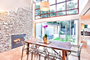 Modern dining area indoor with glass panels and windows