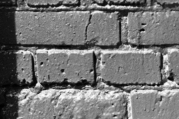Freshly painted brick wall close up. Monochrome abstract background