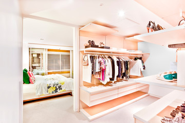 Bedroom attached to the garment store room of a house