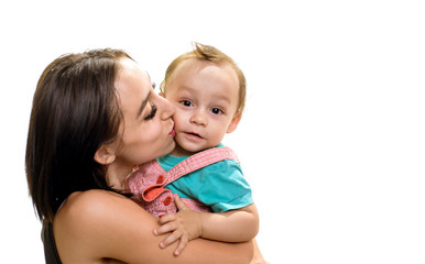 The joy of safe motherhood. Pretty woman kiss small baby son. Mother and son. Mother and child. Small baby and young woman. Family love and trust. Motherhood skills. This love is silent, copy space