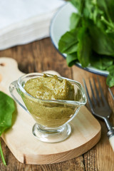 Sorrel sauce on wooden background