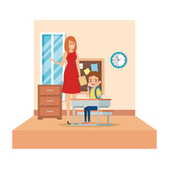 female teacher and boy seated in desk in the classroom
