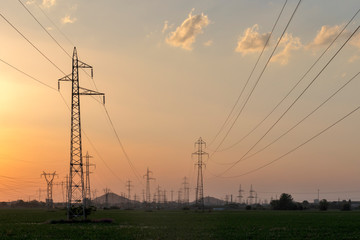 Fototapeta premium Sunset Landscape of High-voltage power lines in the land around city of Plovdiv, Bulgaria