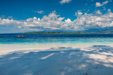 Tropical beach and blue ocean in paradise island