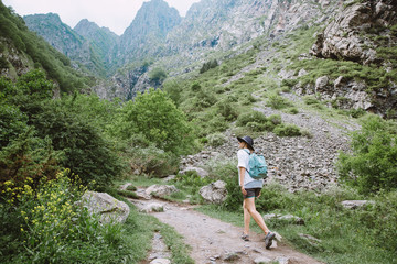 Young lady tourist hiking in the mountains of Georgia