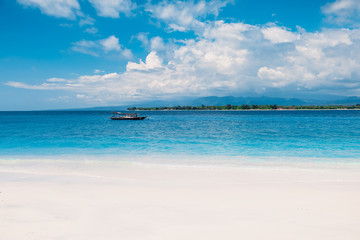 Tropical beach and blue ocean in paradise island