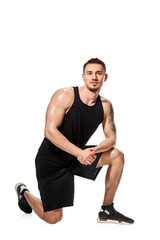 Obraz premium Fit strong muscular tattooed man posing on white background