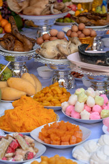 Sacrificial offering food for pray to god and memorial to ancestor, Bangkok, Thailand. Traditional offerings to gods with food, vegetable and fruit for the gods of Thai culture