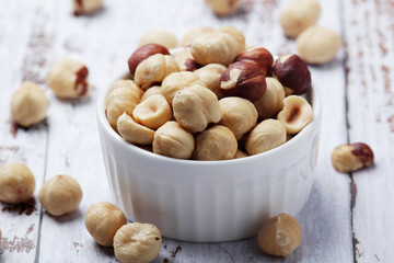A bowl with shelled hazel nuts	