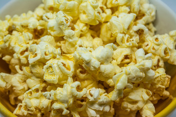 Popcorn is a snack made from corn kernels it is white color popular for people in many countries.