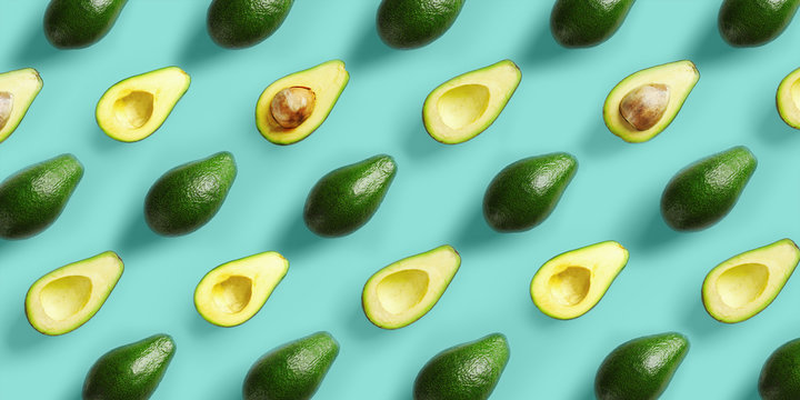 Avocado pattern on blue background. Pop art design, creative summer food concept. Green avocadoes, minimal flat lay style