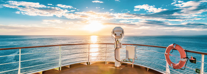 Summer cruise vacation concept. Panoramic view of the sea with a beautiful sunset just above the horizon. - obrazy, fototapety, plakaty