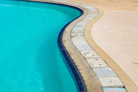 Swimming pool edge with ladder in home