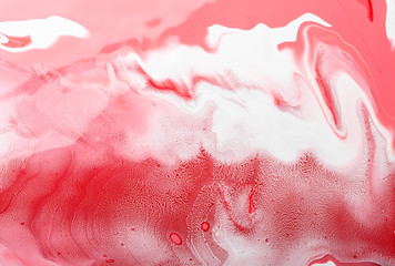 Acrylic Fluid Art. Red white waves and curls. Abstract swirling background or texture