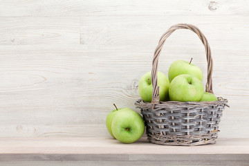 Fresh garden green apples in basket