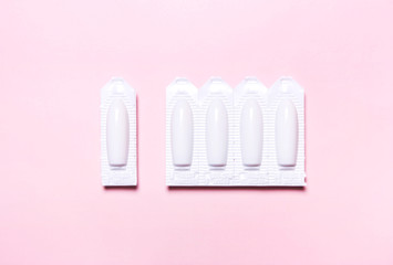 suppository on a pink background, for the treatment of hemorrhoids, vaginal  candidiasis