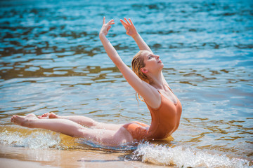 Ballerina at beach. Ballet dancer dancing outdoor. Concept of freedom and sport body