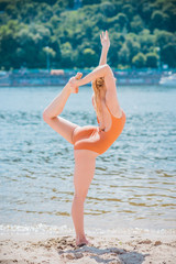 Ballerina at beach. Ballet dancer dancing outdoor. Concept of freedom and sport body