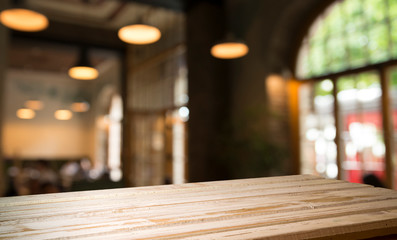 blurred background of bar and dark brown desk space of retro wood