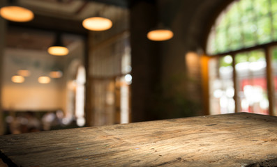 blurred background of bar and dark brown desk space of retro wood