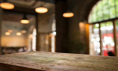 Fototapeta na wymiar blurred background of bar and dark brown desk space of retro wood
