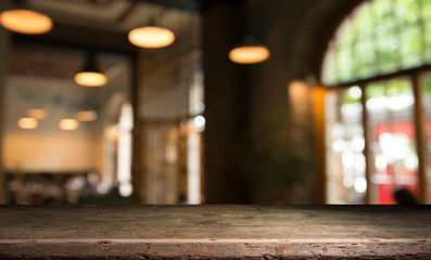 blurred background of bar and dark brown desk space of retro wood