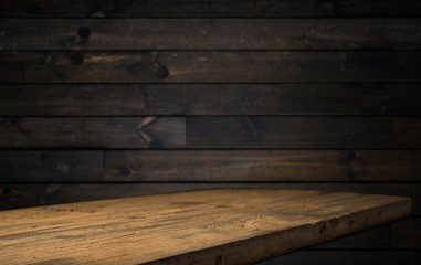 image of wooden table in front of abstract blurred background of resturant lights