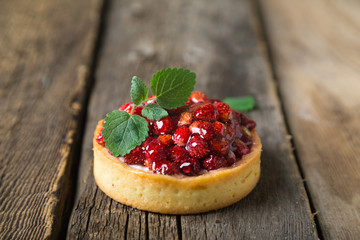 Cakes with fresh berries and mint leaves