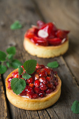 Cakes with fresh berries and mint leaves