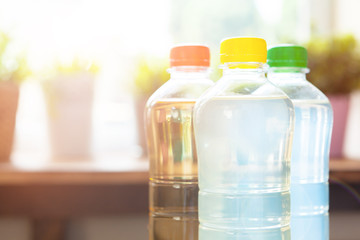 Obraz na płótnie Canvas plastic bottles with soft drinks background close up