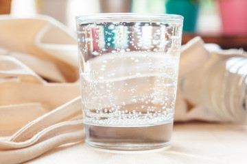 Glass of pure water on kitchen table